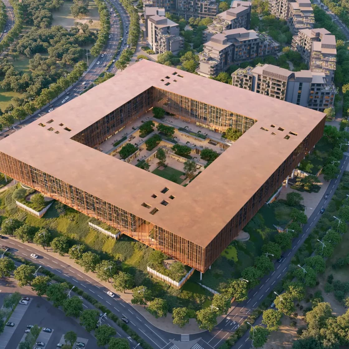 Aerial render of The Yards Plaza by BEYOND, a square copper-clad office building wrapped around a planted courtyard on Sheikh Mohammed Bin Zayed Road, Dubai